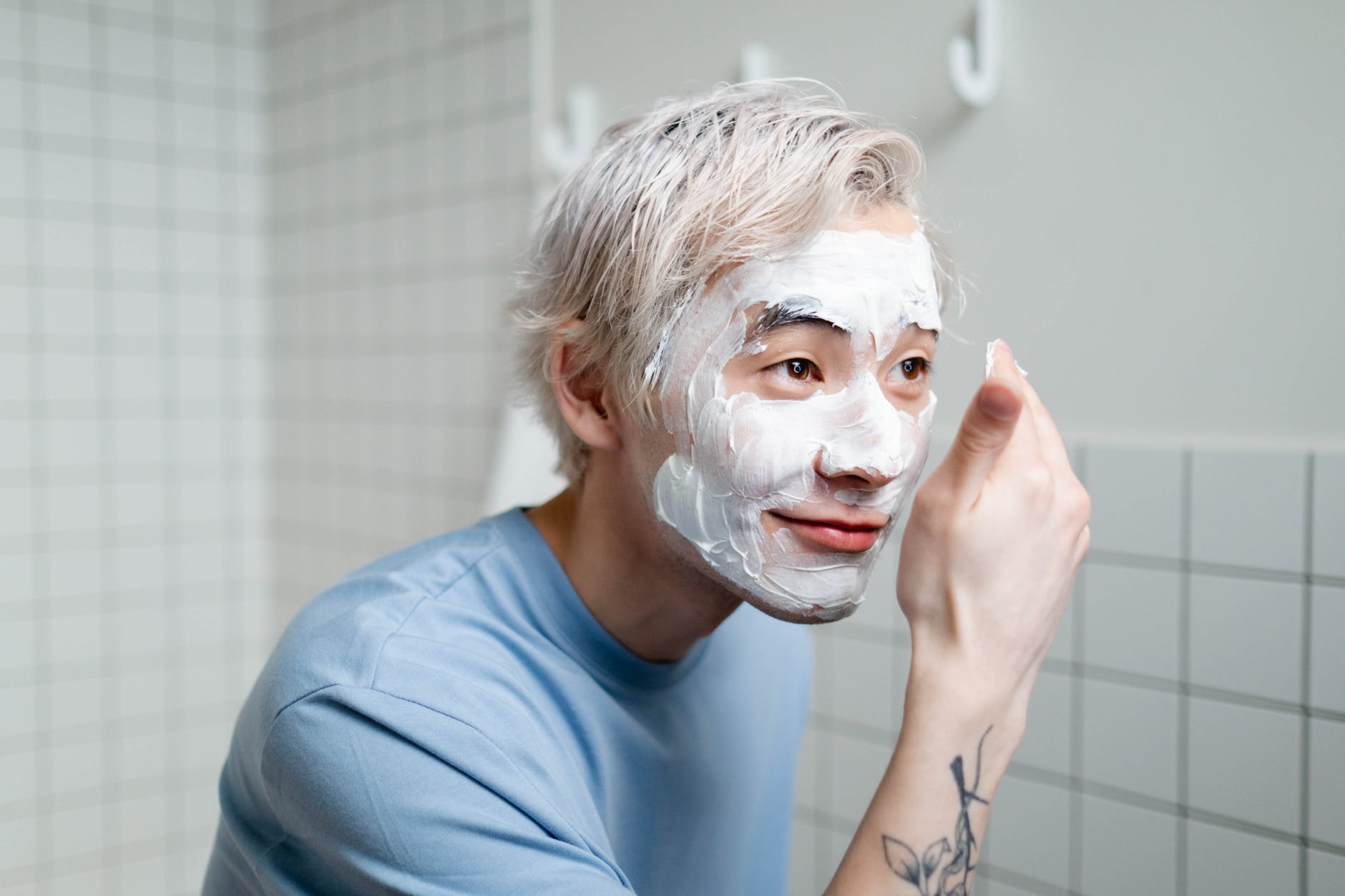 man doing a facial skincare mask