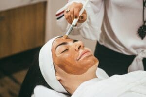 person getting a facial treatment at a spa