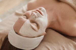 person with a skincare mask on laying down