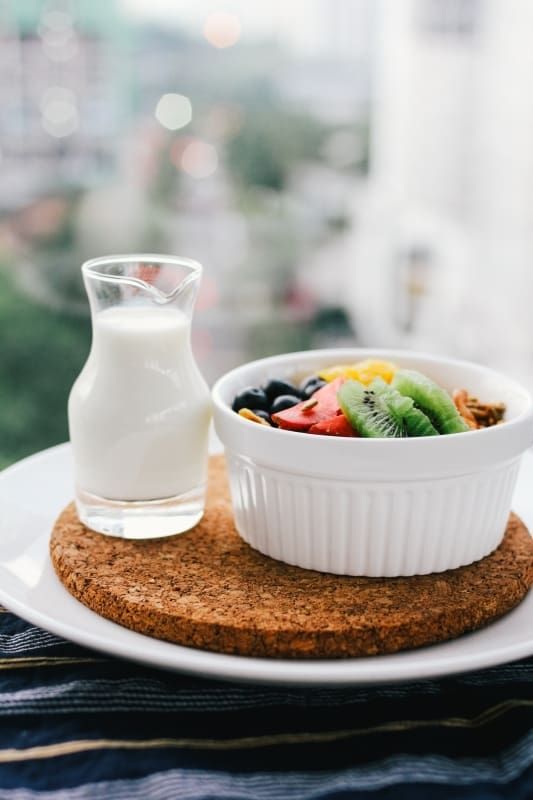 fruit bowl and glass of milk