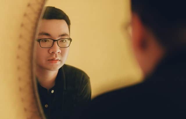 man looking into the mirror