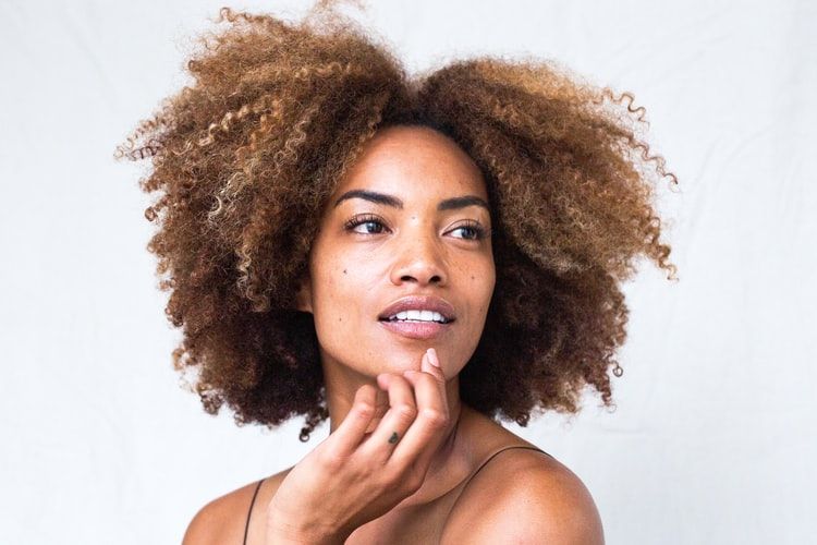 african american woman with a fresh beautiful face looking off camera